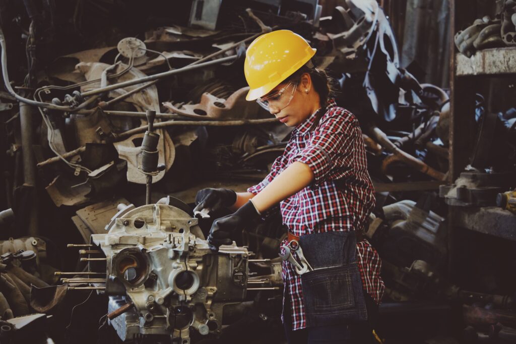 a women working on the maintenance of cnc machine